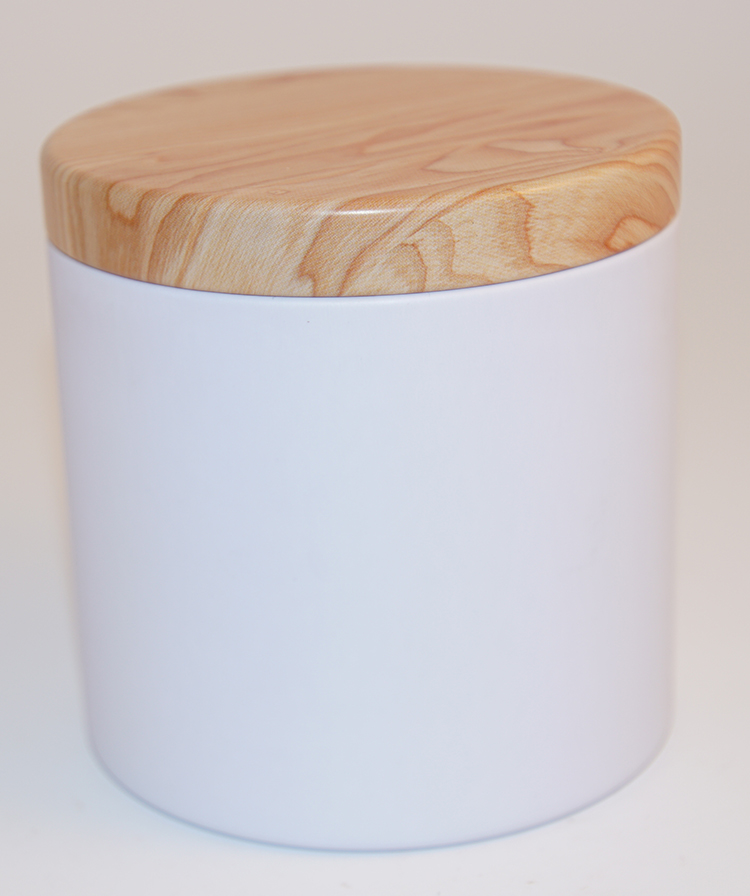 Round white jar with bamboo decoration on the lid