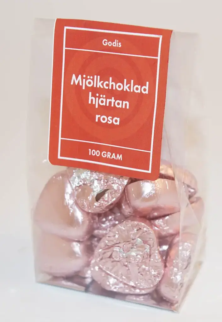 Mjölkchoklad hjärtan Rosa papper i ståpåse