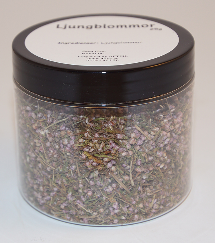 Ljungblommor i PET-burk med svart lock